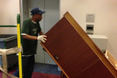 Desk hauling on dolly to prevent damage Alexandria VA